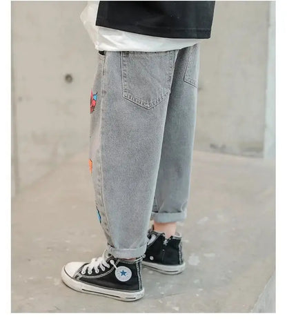 Boys' Jeans Spring and Autumn New Funny Head Medium and Big Children's Casual Children's Clothing Spring Loose Long Pants